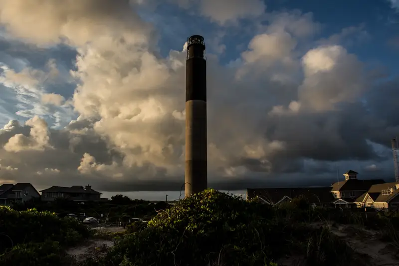 Storm clouds over the Oak Island Lighthouse at Caswell Beach